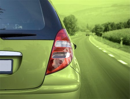 simsearch:400-05038645,k - Green car on the road Stock Photo - Budget Royalty-Free & Subscription, Code: 400-03995005