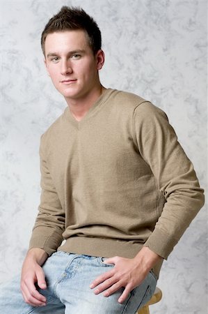 Cute male model in v-neck sweater Foto de stock - Royalty-Free Super Valor e Assinatura, Número: 400-03995127