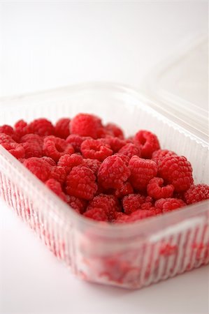 plastic bathtub - plastic basket of raspberries on white background Stock Photo - Budget Royalty-Free & Subscription, Code: 400-03995226