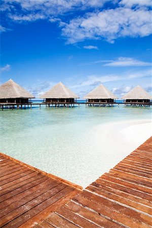 simsearch:400-05742448,k - tropical beach: tropical resort and cloudy sky Stock Photo - Budget Royalty-Free & Subscription, Code: 400-03995267