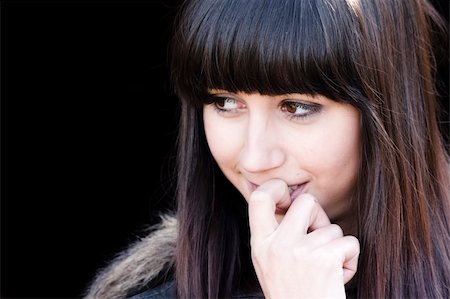 simsearch:400-05064591,k - Closeup girl portrait against black background Stock Photo - Budget Royalty-Free & Subscription, Code: 400-03995306