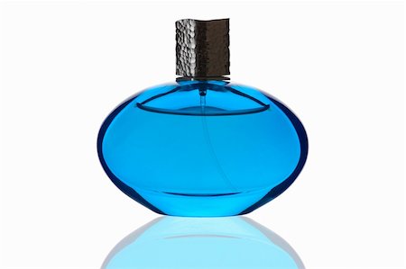 simsearch:700-06892568,k - Blue perfume bottle with reflection on white background Stock Photo - Budget Royalty-Free & Subscription, Code: 400-03995330