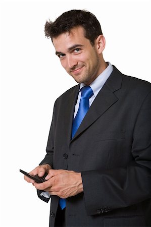 pager - Handsome brunette young smiling business man wearing business suit with blue tie holding a pager and looking at camera over white background Stock Photo - Budget Royalty-Free & Subscription, Code: 400-03995584