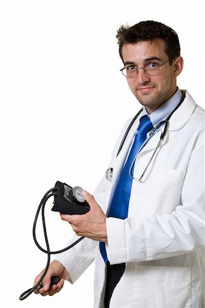 simsearch:400-04217553,k - Young attractive man doctor wearing white lab coat and eyeglasses holding a blood pressure cuff wearing a stethoscope around shoulders smiling standing on white background Foto de stock - Royalty-Free Super Valor e Assinatura, Número: 400-03995586