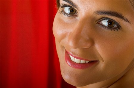 simsearch:400-04869308,k - Beautiful young woman portrait on a red background Stockbilder - Microstock & Abonnement, Bildnummer: 400-03996292