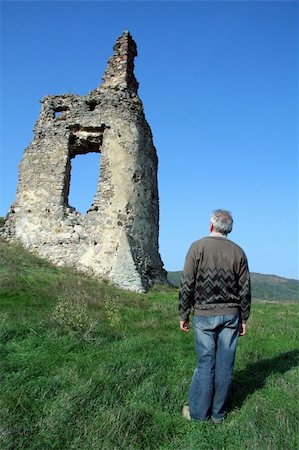simsearch:400-06736198,k - old man looking at old castle ruins, east Slovakia Stock Photo - Budget Royalty-Free & Subscription, Code: 400-03996355