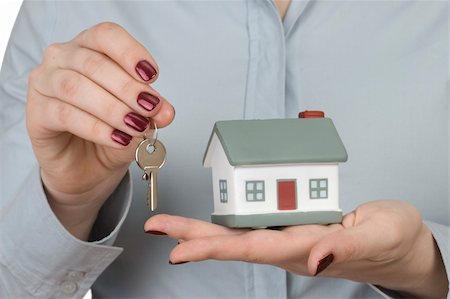 The key and house in woman hands Stock Photo - Budget Royalty-Free & Subscription, Code: 400-03997049