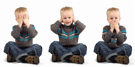 Young boy playing don't see, don't hear, don't speak. Fotografie stock - Microstock e Abbonamento, Codice: 400-03997860