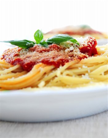 simsearch:400-03992643,k - Pasta with tomato sauce basil and grated parmesan Stock Photo - Budget Royalty-Free & Subscription, Code: 400-03997877