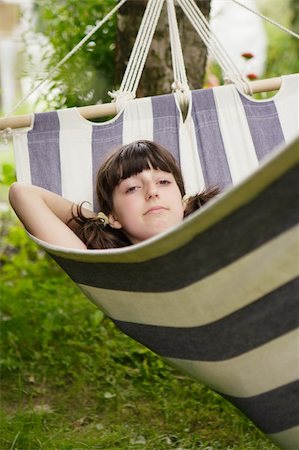 simsearch:400-05739745,k - The girl lays in a hammock Stock Photo - Budget Royalty-Free & Subscription, Code: 400-03998155