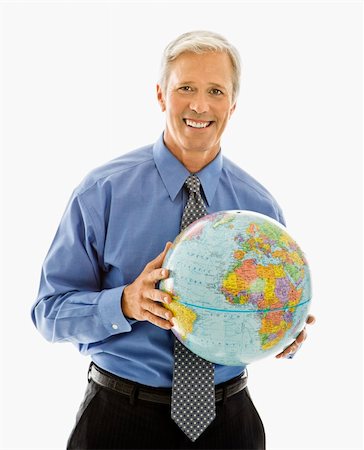 Middle aged Caucasian man holding globe and smiling at viewer. Stock Photo - Budget Royalty-Free & Subscription, Code: 400-03999288
