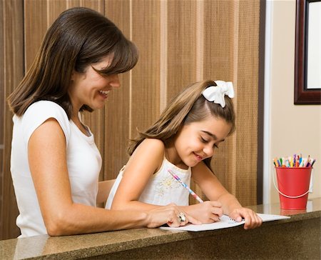 simsearch:640-03262671,k - Hispanic mother helping daughter with homework. Stock Photo - Budget Royalty-Free & Subscription, Code: 400-03999347
