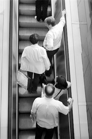 simsearch:400-05024244,k - People ascending escalators and stairs Fotografie stock - Microstock e Abbonamento, Codice: 400-03999761