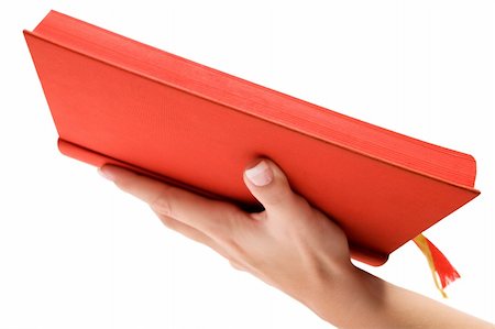 predigen - Female hand holding the holy book. Isolated on a white background. Stockbilder - Microstock & Abonnement, Bildnummer: 400-03999905