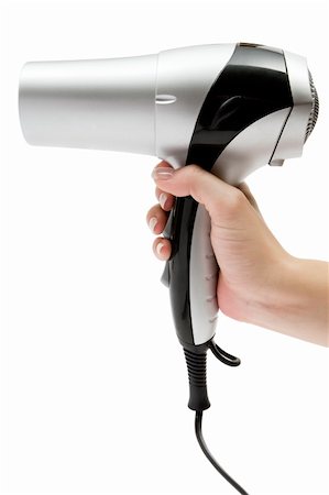 Female hand holding a silver hair drier. Isolated on a white background. Stock Photo - Budget Royalty-Free & Subscription, Code: 400-03999907