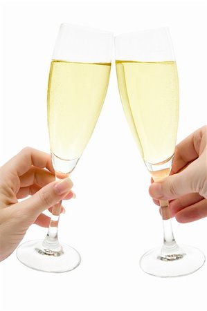 pic of drinking celebration for new year - Man and woman celebrating with two glasses of champagne. Isolated on a white background. Stock Photo - Budget Royalty-Free & Subscription, Code: 400-03999901