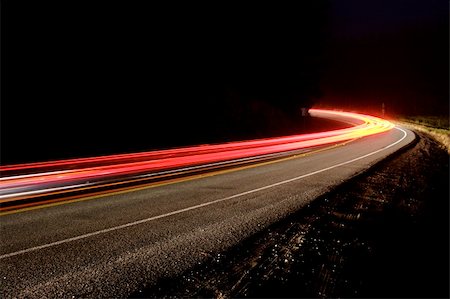 simsearch:400-05666428,k - Long exposure showing the blur of passing cars on mountain road on a foggy night Stock Photo - Budget Royalty-Free & Subscription, Code: 400-03990003