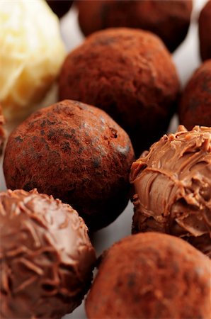 Several assorted gourmet chocolate truffles close up Stock Photo - Budget Royalty-Free & Subscription, Code: 400-03990119