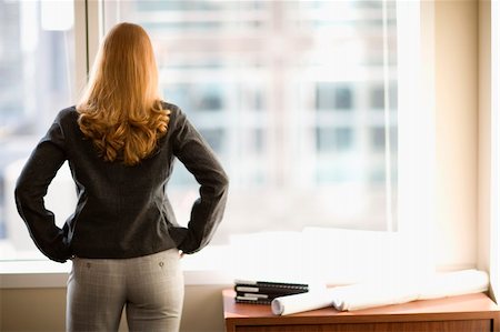 simsearch:400-05351045,k - Rear view of woman looking out office window Stock Photo - Budget Royalty-Free & Subscription, Code: 400-03990593