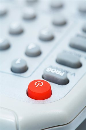 simsearch:400-05223721,k - The red button of inclusion on a remote control Foto de stock - Royalty-Free Super Valor e Assinatura, Número: 400-03991277