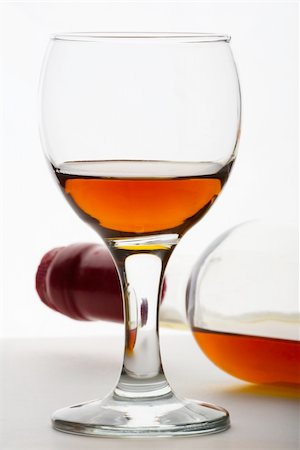 simsearch:400-07501524,k - Cognac or similiar strong spirit in a glass tumbler beside the bottle Stock Photo - Budget Royalty-Free & Subscription, Code: 400-03991658