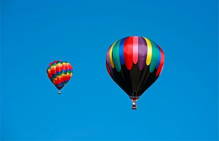 simsearch:400-08032526,k - Two Hot Air Balloons Flying in a Clear Blue Sky Foto de stock - Super Valor sin royalties y Suscripción, Código: 400-03991788