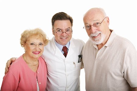 Senior couple posing in their new glasses with their optometrist.  Isolated on white. Stock Photo - Budget Royalty-Free & Subscription, Code: 400-03991973