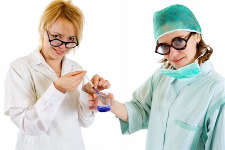 doctor preparing shot - Two women preparing an injection - concept for healthcare professionals, mad scientists or charlatans Stock Photo - Budget Royalty-Free & Subscription, Code: 400-03992056