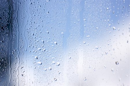 simsearch:400-03966401,k - Rain Drops on Window as the clouds clear behind. Stock Photo - Budget Royalty-Free & Subscription, Code: 400-03992058
