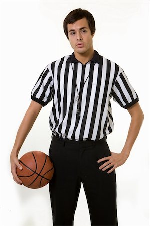 Young brunette man wearing a referee striped black and white top holding a basketball Stock Photo - Budget Royalty-Free & Subscription, Code: 400-03992289