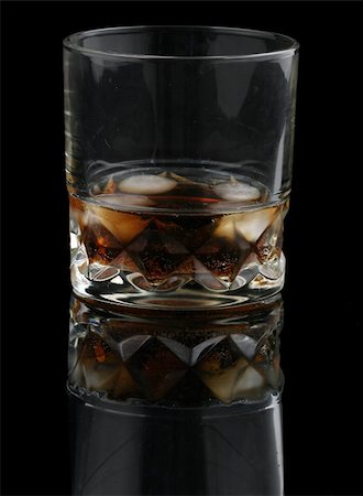 whisky with cola on the rocks isolated on deep black background Stock Photo - Budget Royalty-Free & Subscription, Code: 400-03992752