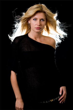 simsearch:400-04502103,k - Beautiful blond hair woman wearing  black with hair blowing and backlit over black Stock Photo - Budget Royalty-Free & Subscription, Code: 400-03992798