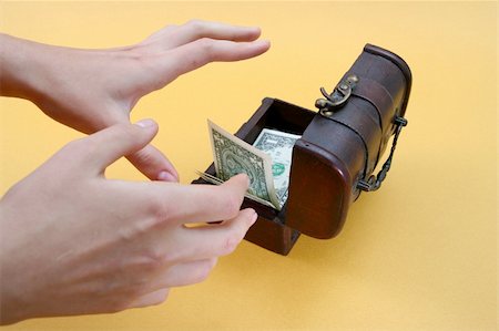 simsearch:400-07774250,k - Wood cashbox isolated on yellow Stock Photo - Budget Royalty-Free & Subscription, Code: 400-03992832