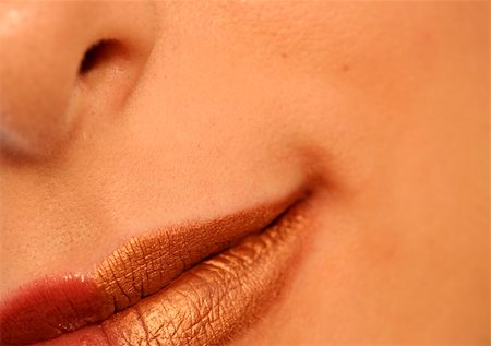 simsearch:400-05676902,k - Macro image of bright lips. Red and gold lipstik Stock Photo - Budget Royalty-Free & Subscription, Code: 400-03992885