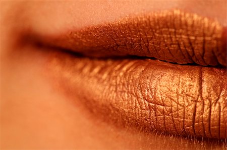 simsearch:400-05676902,k - Macro blur image of bright lips -gold lipstik Stock Photo - Budget Royalty-Free & Subscription, Code: 400-03992887