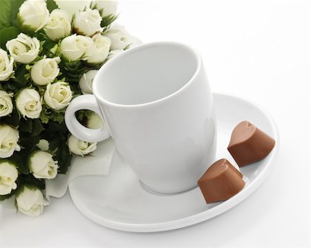A bunch of flowers, coffee-cup and a pair heart of chocolate Stock Photo - Budget Royalty-Free & Subscription, Code: 400-03993239