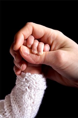 Big  hand holding her baby's hand Stock Photo - Budget Royalty-Free & Subscription, Code: 400-03993302