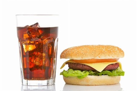 Cheeseburger and soda glass, reflected on white background. Shallow DOF Stock Photo - Budget Royalty-Free & Subscription, Code: 400-03993589
