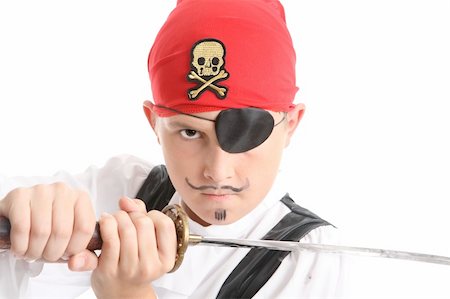 simsearch:400-04098342,k - Child play acting a Pirate.  He is wearing an eye patch, wielding a sword and has a mean stare.    eg halloween Fotografie stock - Microstock e Abbonamento, Codice: 400-03993872