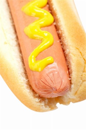 simsearch:400-04035891,k - A hot dog with mustard isolated on white background. Shallow DOF Fotografie stock - Microstock e Abbonamento, Codice: 400-03993917