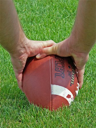 sparkia (artist) - hands on an American football Stockbilder - Microstock & Abonnement, Bildnummer: 400-03993951