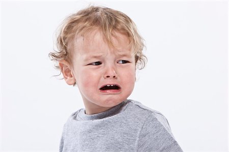 frustrated child white background - Portrait of Boy Crying Stock Photo - Premium Royalty-Free, Code: 600-04183470