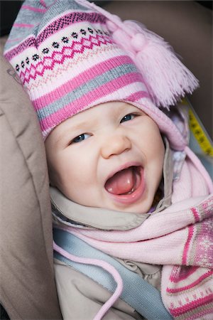 Close-up of Baby Girl Sitting in Car Seat wearing Winter Clothing Stock Photo - Premium Royalty-Free, Code: 600-04425024