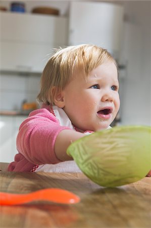 Baby girl Eating from Bowl Stock Photo - Premium Royalty-Free, Code: 600-04425163