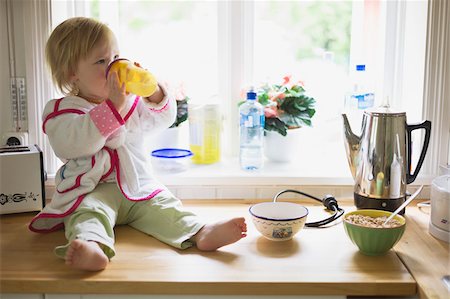 swedish home - Girl on Kitchen Counter Stock Photo - Premium Royalty-Free, Code: 600-04525181