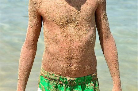 Boy Covered in Sand, Saint-Florent, Corsica, France Stock Photo - Premium Royalty-Free, Code: 600-04625250