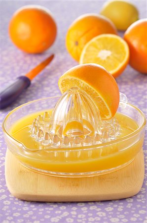 simsearch:600-06553477,k - Oranges and Juicer Stock Photo - Premium Royalty-Free, Code: 600-04625253