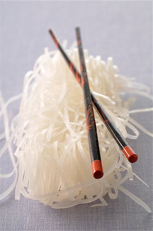 Dry Rice Noodles and Chopsticks Stock Photo - Premium Royalty-Free, Code: 600-04625260