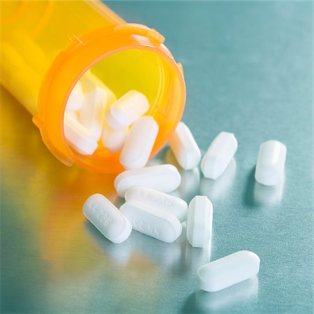 prescription drugs bottles pictures - Pills Spilling from Bottle Stock Photo - Premium Royalty-Free, Code: 600-04981829