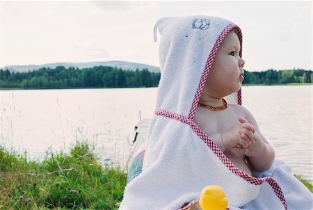 Baby Girl in Towel by Lake Stock Photo - Premium Royalty-Free, Code: 600-05181883